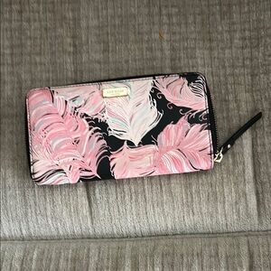 Kate Spade Neda feather wallet. Pink and blue on black background 7 1/2 x 4.